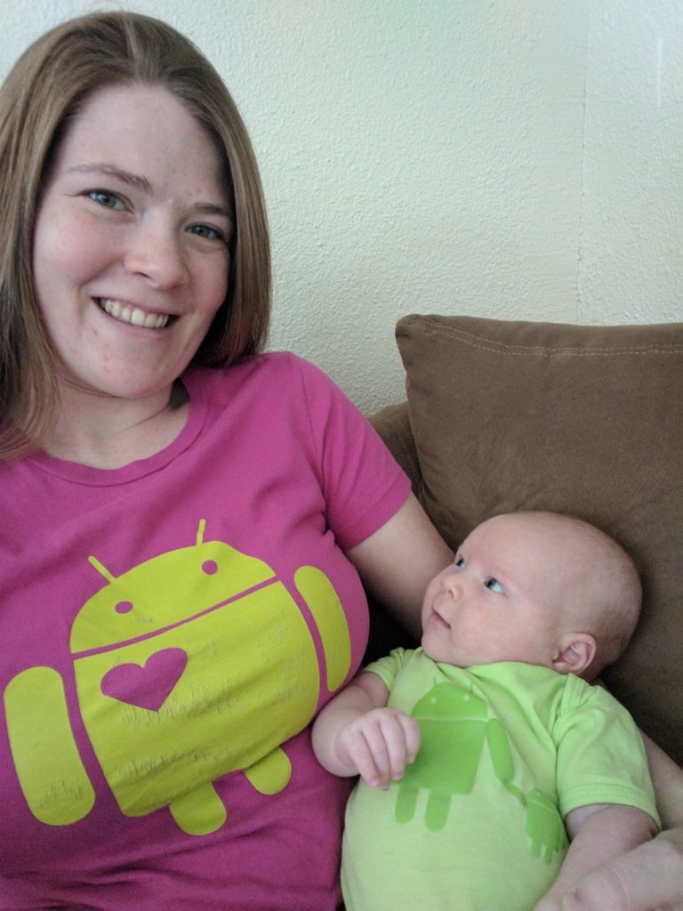 Kelly and baby, both dressed in Android shirts